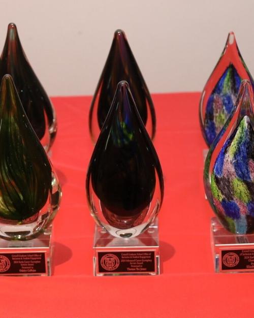 Six awards made of colored glass