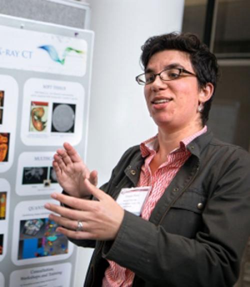 Teresa Porri, CT manager for Cornell’s Institute of Biotechnology, discusses her poster illustrating the Biotechnology Resource Center’s Imaging Facilities