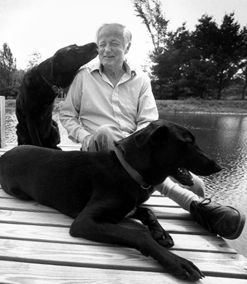  James McConkey, professor of English, with dogs.